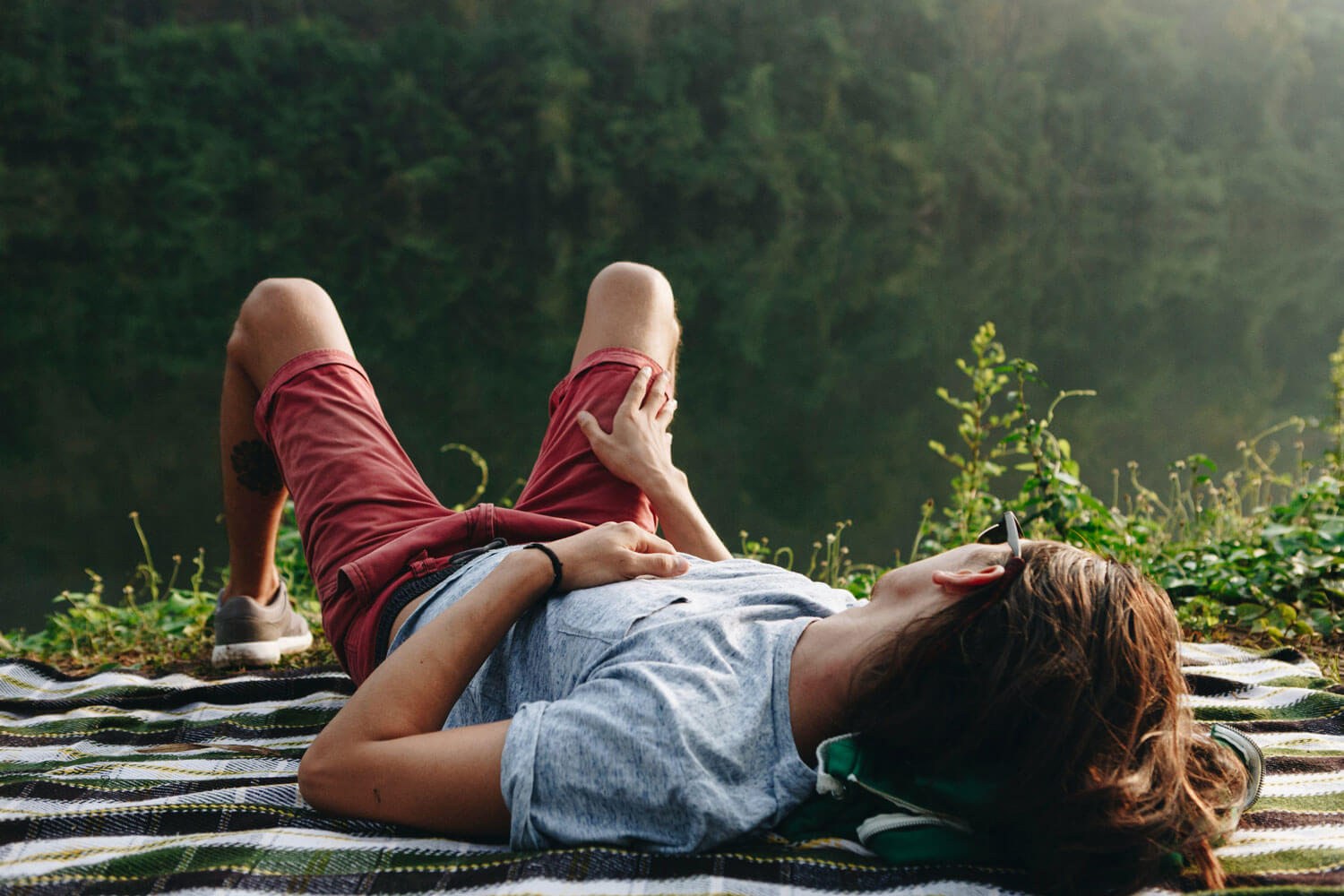 Person resting by a river