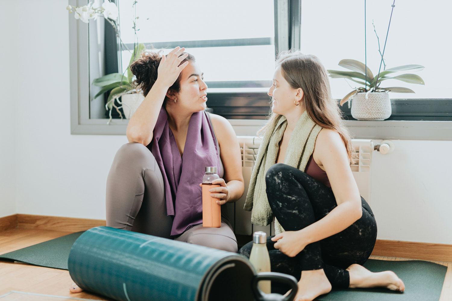 Two women speaking after working out