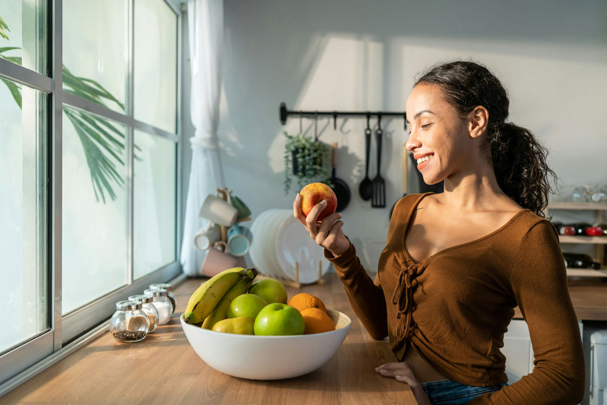 Person holding an apple