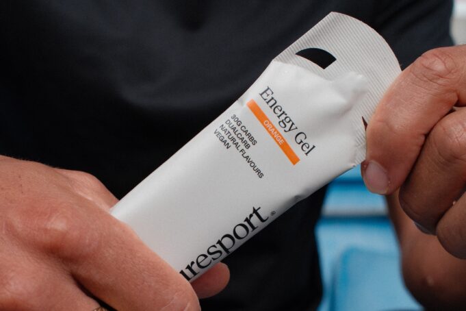 up close visual of hands holding puresport energy gel